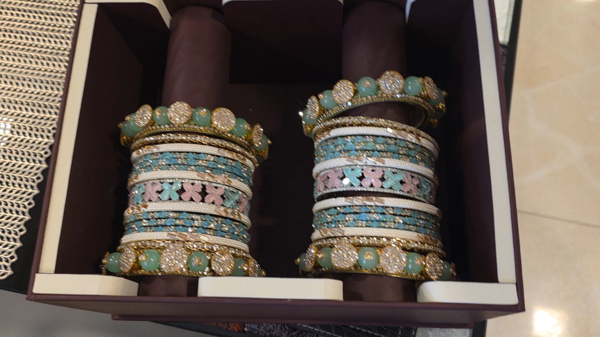 Photograph of the paired bangle arrangement in the plum box.